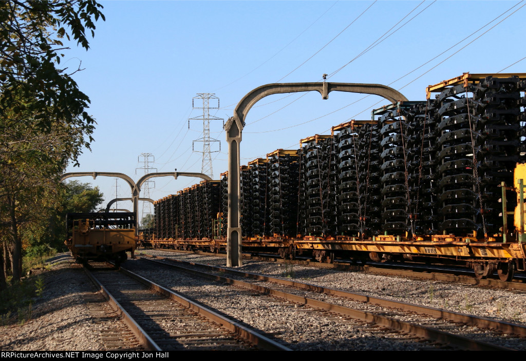 Loaded frame flats sit under the DT&I arches waiting to head down to Flat Rock